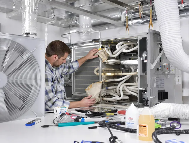 Central Falls Air Duct Cleaning specialist performing precision AC coil cleaning in Central Falls