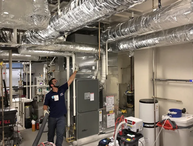 Central Falls Air Duct Cleaning specialist performing thorough furnace duct cleaning in a Central Falls residence