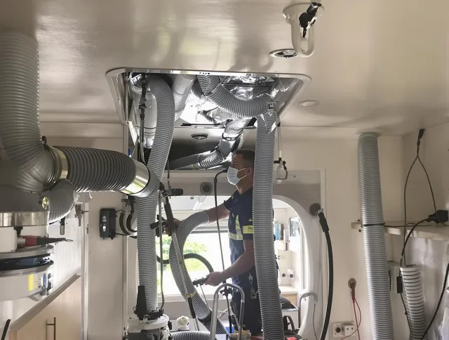 Central Falls Air Duct Cleaning specialist performing precise mobile home duct cleaning in Central Falls