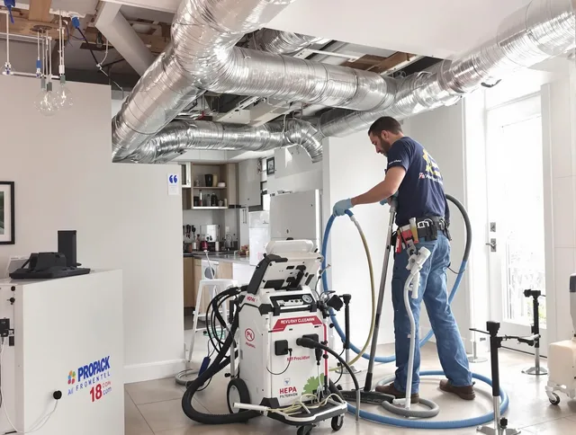 Central Falls Air Duct Cleaning technician performing advanced pure duct cleaning with specialized equipment in Central Falls